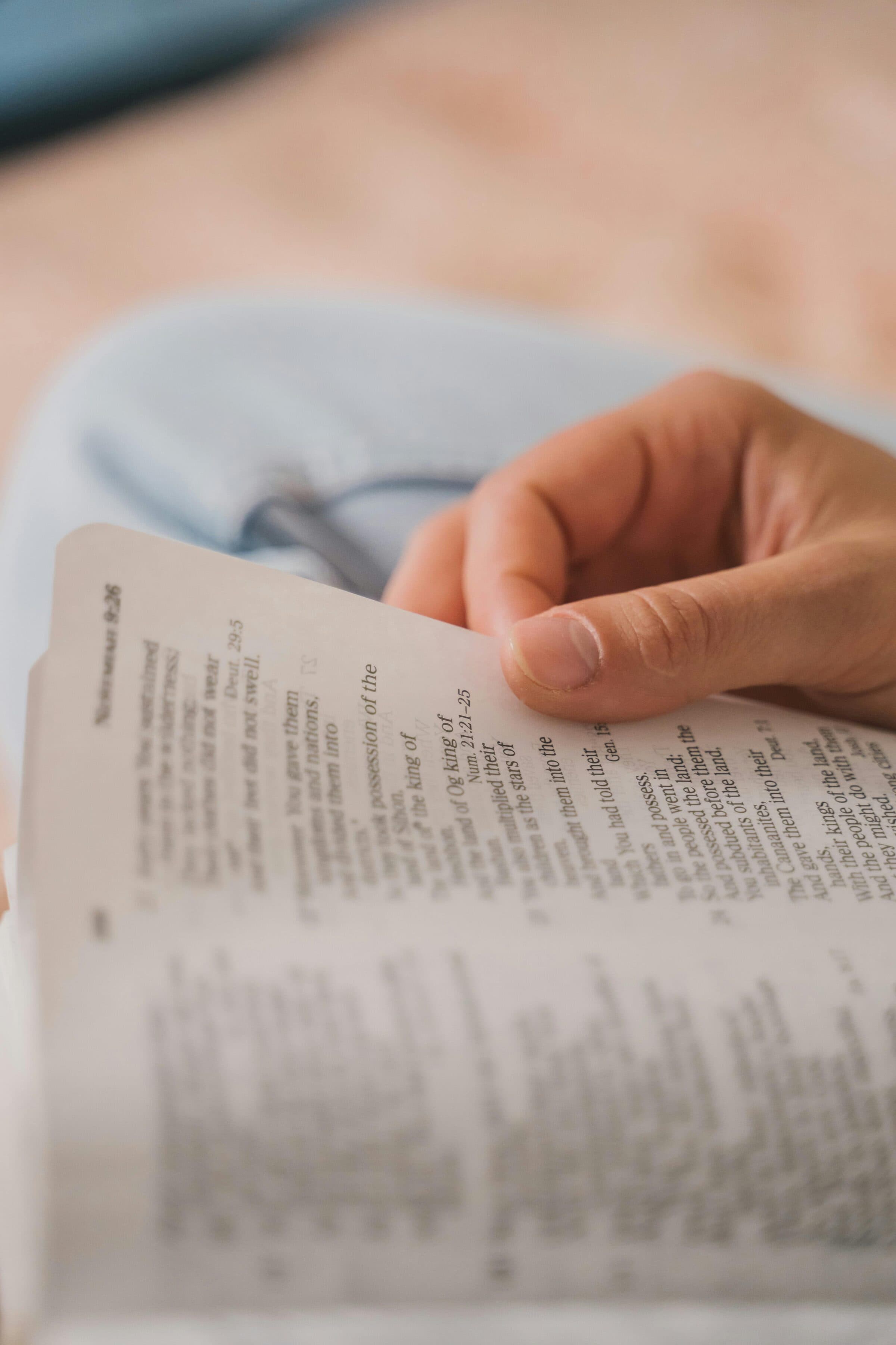 A worshipper following along in an open Bible